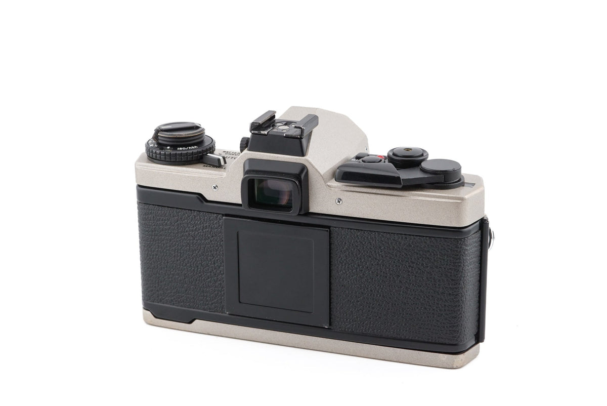 Discover the timeless beauty of the Olympus OM-4 Ti at Camerashop 